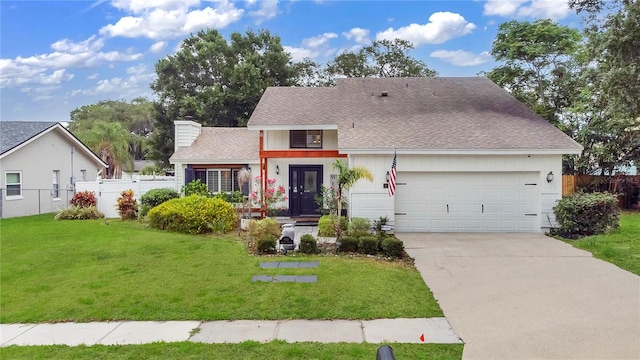 view of front facade featuring a garage and a front lawn