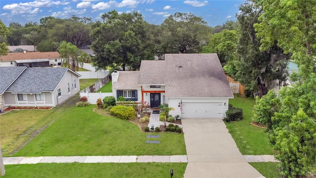 view of front of property featuring a garage and a front lawn