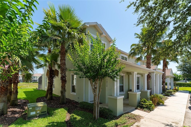 view of side of home featuring a yard