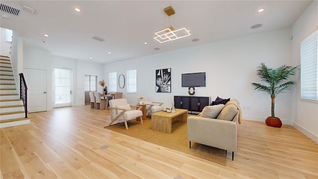 living room with light hardwood / wood-style flooring