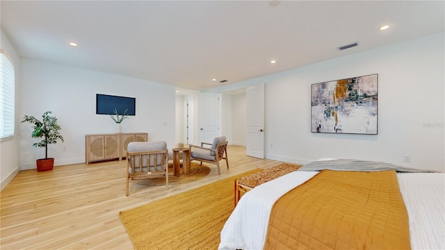 bedroom with wood-type flooring