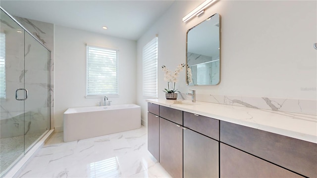 bathroom with independent shower and bath and vanity