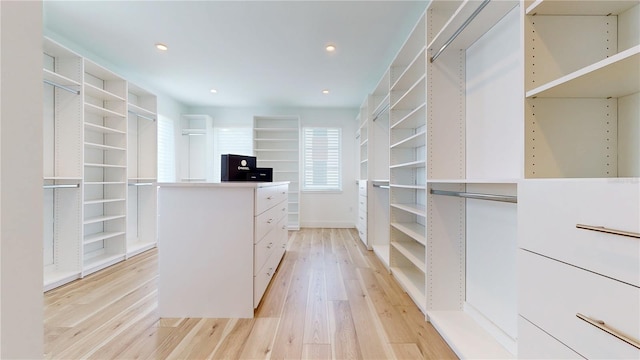 spacious closet featuring light hardwood / wood-style floors