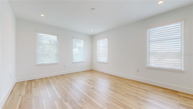 unfurnished room with light hardwood / wood-style flooring