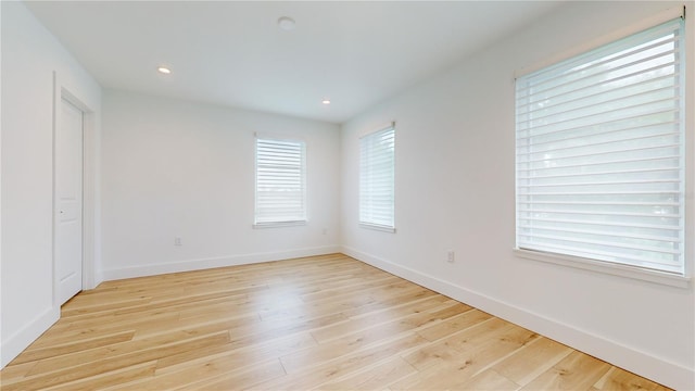 spare room with light hardwood / wood-style floors