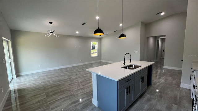 kitchen with an island with sink and sink