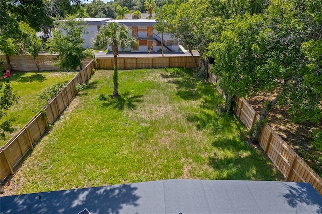 view of yard with a fenced backyard