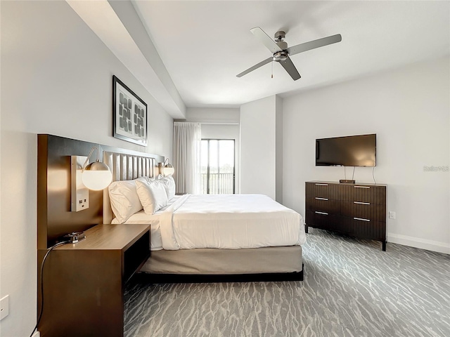 bedroom featuring ceiling fan and dark colored carpet