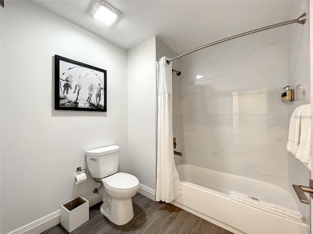 bathroom featuring shower / bathtub combination with curtain, toilet, and hardwood / wood-style flooring