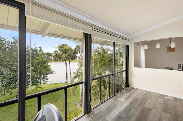 unfurnished sunroom featuring a water view, plenty of natural light, and lofted ceiling