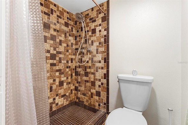 bathroom with walk in shower and toilet