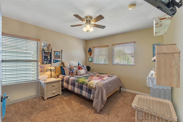 bedroom featuring ceiling fan, light colored carpet, and multiple windows