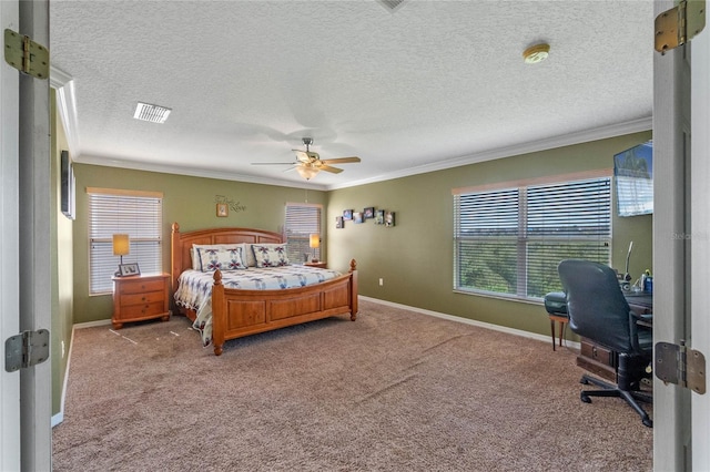 carpeted bedroom with ceiling fan, ornamental molding, and a textured ceiling