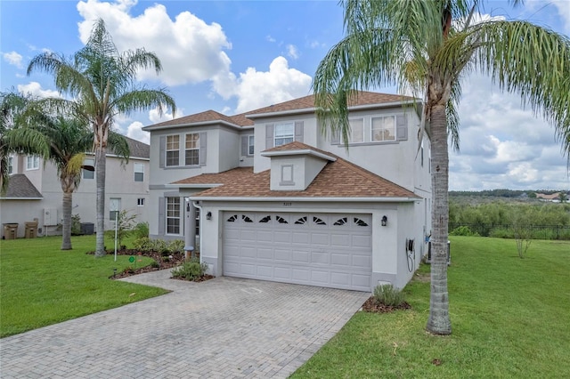 view of front facade featuring a garage and a front yard