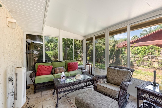 sunroom / solarium featuring vaulted ceiling