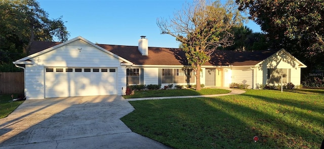 single story home featuring a garage, fence, concrete driveway, a chimney, and a front yard