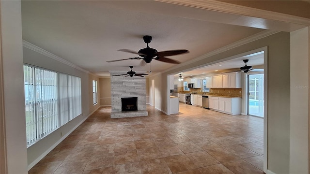 unfurnished living room featuring ornamental molding, a stone fireplace, light tile patterned floors, and baseboards