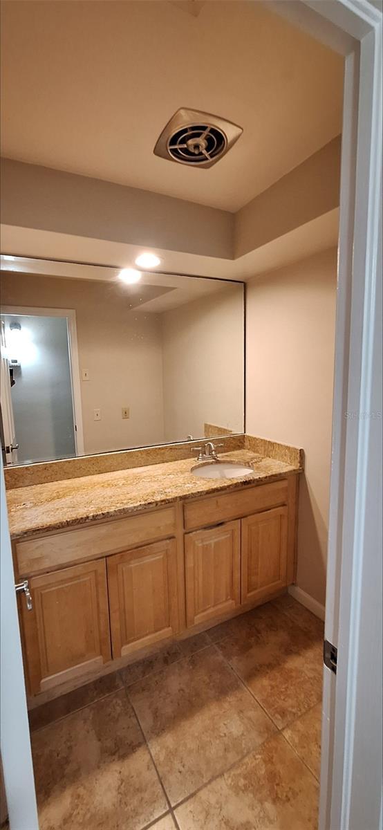 bathroom with vanity and tile patterned floors