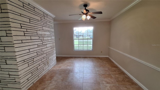 spare room featuring light tile patterned floors, ceiling fan, baseboards, and crown molding