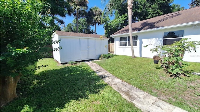 view of yard featuring an outbuilding and a storage unit