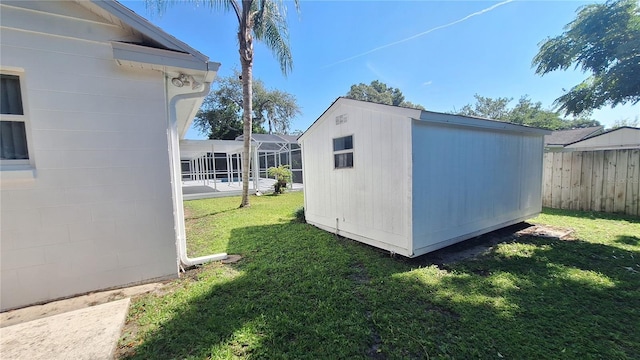 view of shed with fence