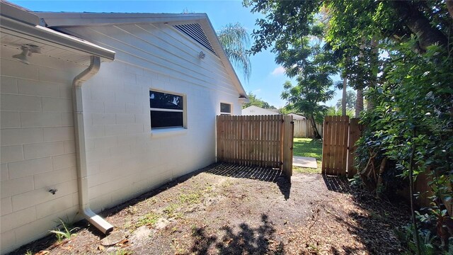 1030 Gregory Dr, Maitland, FL 32751 - view of side of home with concrete block siding and fence