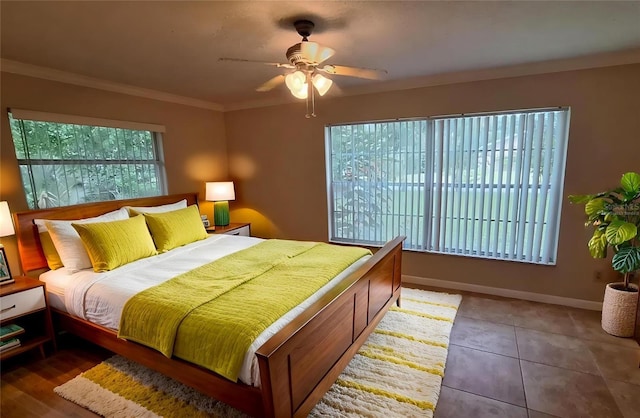 1030 Gregory Dr, Maitland, FL 32751 - bedroom featuring a ceiling fan, tile patterned floors, baseboards, and ornamental molding