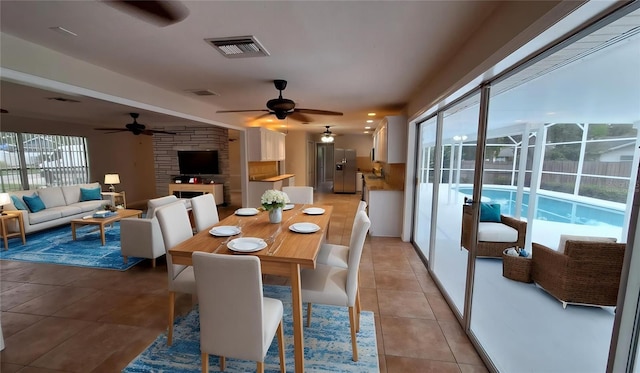 1030 Gregory Dr, Maitland, FL 32751 - dining space featuring light tile patterned floors, ceiling fan, and visible vents
