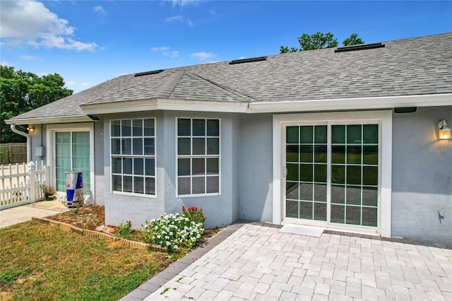 property entrance with a patio