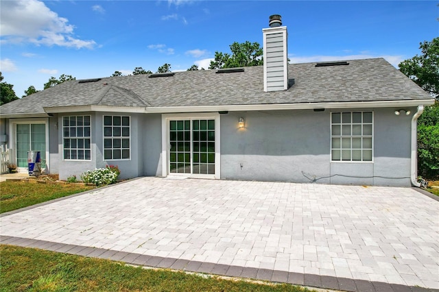 back of house featuring a patio area