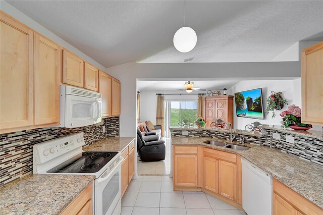 kitchen featuring sink, light brown cabinetry, white appliances, and light tile flooring