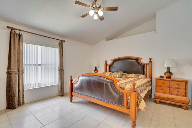 bedroom featuring tile flooring, ceiling fan, and vaulted ceiling