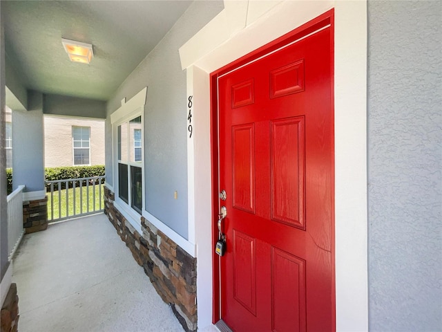 property entrance with a porch