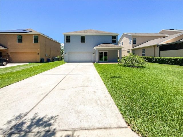 view of property featuring a garage and a front yard