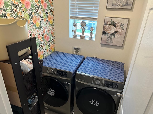 laundry area with independent washer and dryer