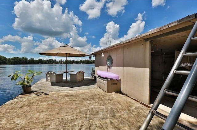 view of patio with a water view