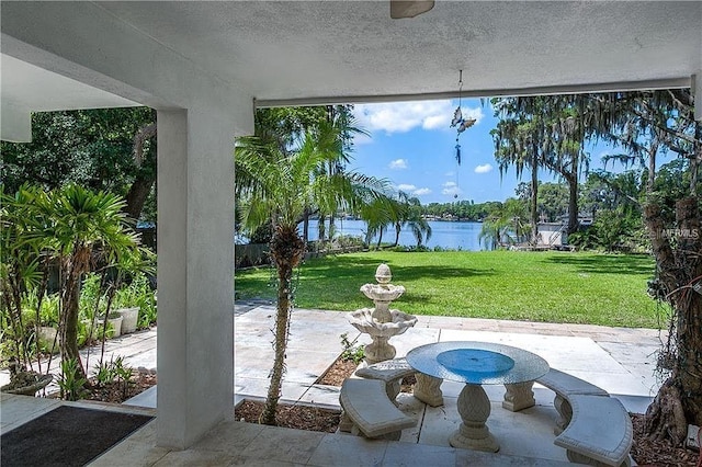 view of patio featuring a water view