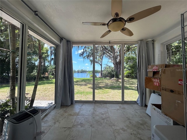 unfurnished sunroom with a water view