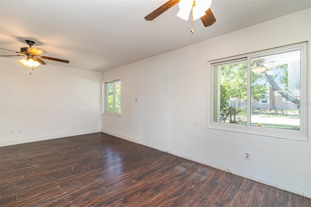 spare room with ceiling fan, wood-type flooring, and a wealth of natural light