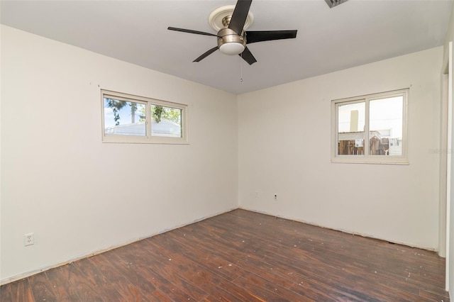 spare room with ceiling fan and hardwood / wood-style flooring