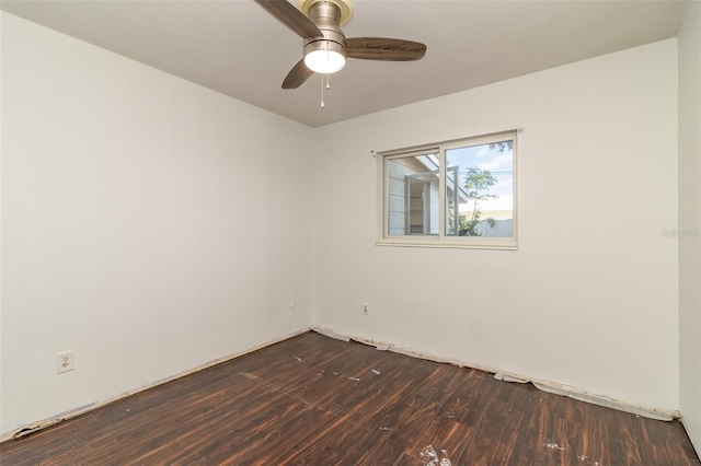 spare room with ceiling fan and wood-type flooring