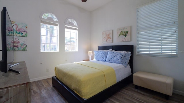 bedroom with wood-type flooring and ceiling fan