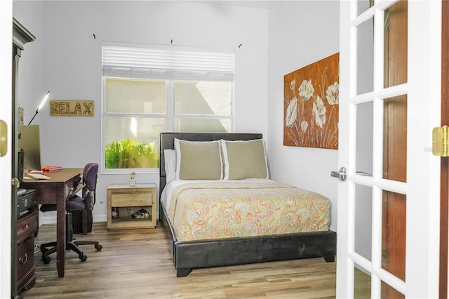 bedroom featuring wood-type flooring