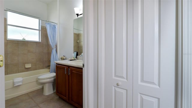 full bathroom with toilet, vanity, tile patterned floors, and shower / tub combo