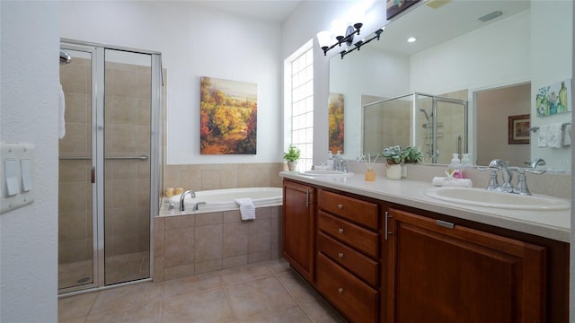 bathroom with vanity, independent shower and bath, and tile patterned flooring