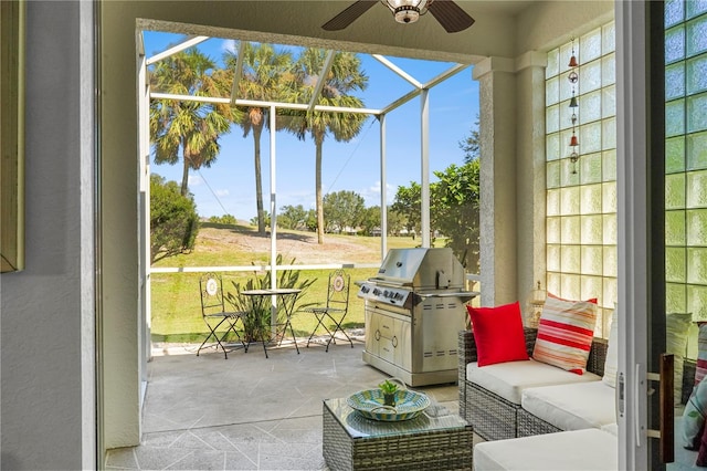 sunroom / solarium featuring ceiling fan