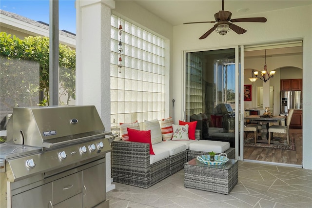 view of patio with an outdoor kitchen, a grill, and ceiling fan