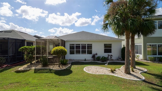 rear view of house with a lawn