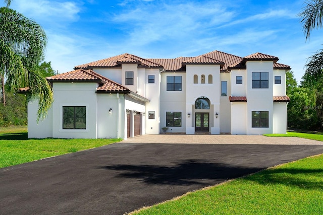 mediterranean / spanish-style house featuring a garage