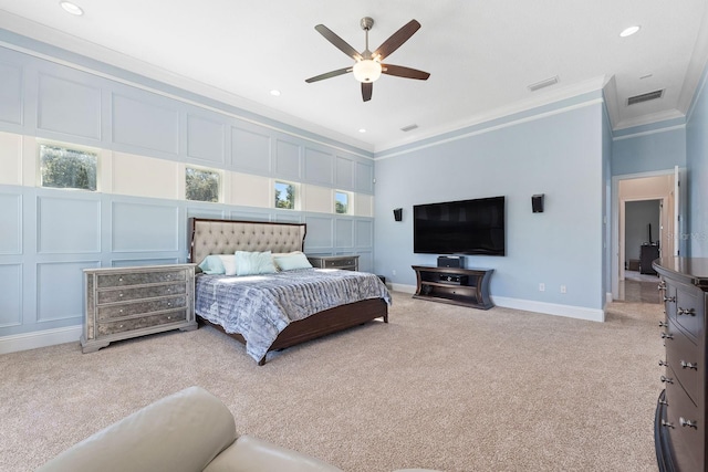 bedroom featuring crown molding, ceiling fan, and light colored carpet